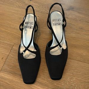 Gorgeous satin pumps with rhinestone embellishments.  Size 8.5.